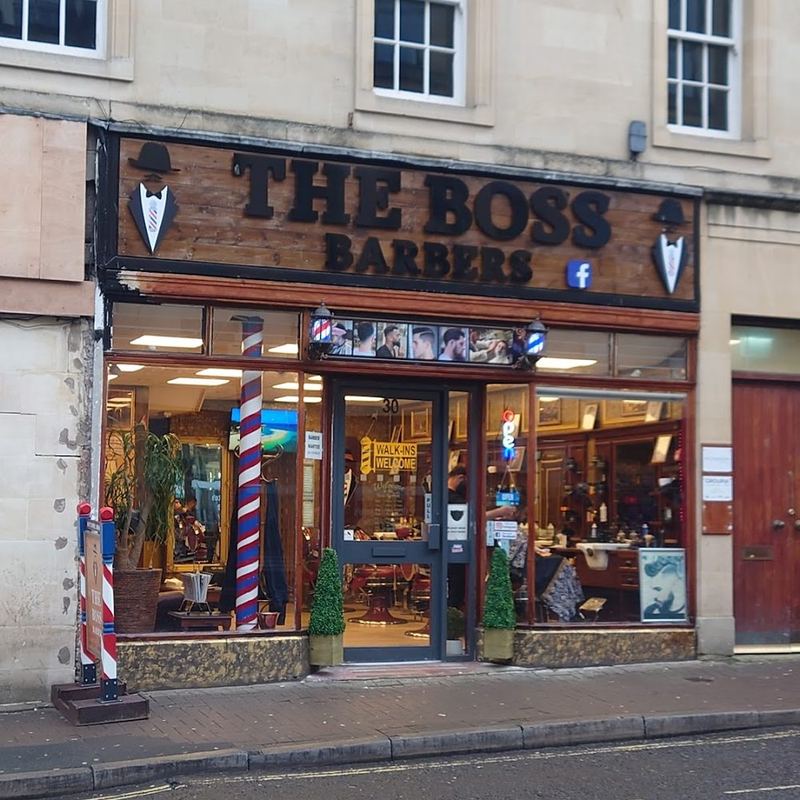The Boss Barbers shopfront and barber pole at 30 Westgate Buildings, Bath